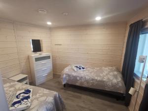 Postelja oz. postelje v sobi nastanitve Maglelin Experience Lodge