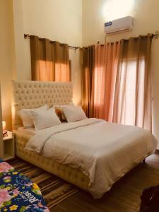 Ένα ή περισσότερα κρεβάτια σε δωμάτιο στο Résidence ALMA