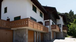 a building with balconies on the side of it at Italianway - Monte Solena 45C in Bormio