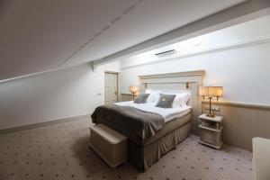 Säng eller sängar i ett rum på Villa Friedheim