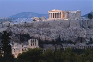 a view of the acropolis of athens from the city at Elaėa Boutique Apartments in Piraeus