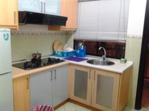 Una cocina o zona de cocina en Homestay Serviced Apartment - Marina Court