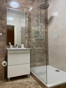a bathroom with a shower and a sink and a mirror at Lustforlife in Odesa +37 photos