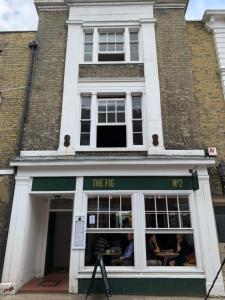 a building with a sign that reads the fig at The fig in Rye