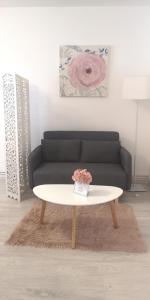 a living room with a couch and a coffee table at Diamond Apartment in Târgu-Mureş