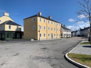 an empty street in a town with buildings at Stylish & Modern Apartment in Inverness