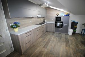 A kitchen or kitchenette at Shiny Star Apartmán