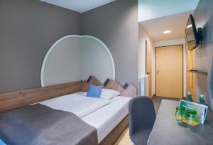 Posteľ alebo postele v izbe v ubytovaní JUFA Hotel Wipptal