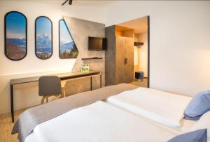 Posteľ alebo postele v izbe v ubytovaní JUFA Hotel Wipptal