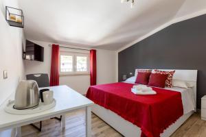 Postel nebo postele na pokoji v ubytování Cadoni Guest House