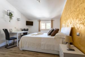 Postel nebo postele na pokoji v ubytování Cadoni Guest House