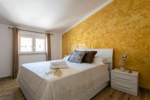 Postel nebo postele na pokoji v ubytování Cadoni Guest House