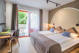 Posteľ alebo postele v izbe v ubytovaní JUFA Hotel Wipptal