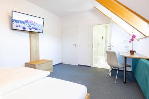 Tempat tidur dalam kamar di Hotel Eydt Kirchheim