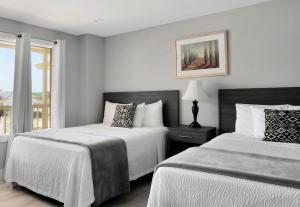 En eller flere senge i et værelse på A Wave Inn - Montauk