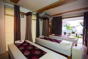 Postel nebo postele na pokoji v ubytování Infinity Resort + 37 fotografií