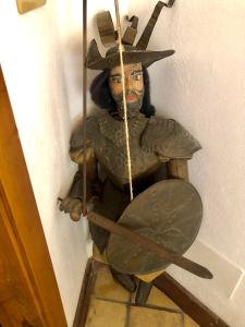 a statue of a man with a hat and arrows at Villa Almoezia Charming B&B in Taormina
