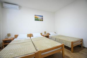 Postel nebo postele na pokoji v ubytování Apartman 59 + 4 fotografie
