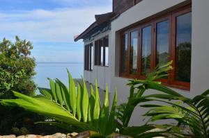a house with a view of the ocean at Blue Parrot in Labuan Bajo