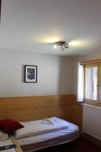 Postel nebo postele na pokoji v ubytování Hotel Le Refuge