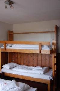Postel nebo postele na pokoji v ubytování Hotel Le Refuge