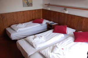 Postel nebo postele na pokoji v ubytování Hotel Le Refuge