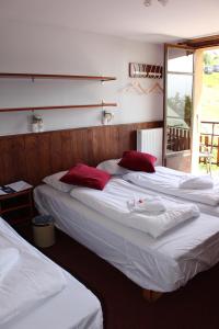 Postel nebo postele na pokoji v ubytování Hotel Le Refuge