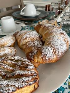 a plate of pastries sitting on a table at L’Angolo Chiaro in Taviano