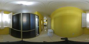 a bathroom with yellow and black walls and a mirror at Chapada Casas da Izete in Lençóis +110 photos