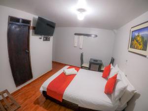 Łóżko lub łóżka w pokoju w obiekcie Machu Picchu Land