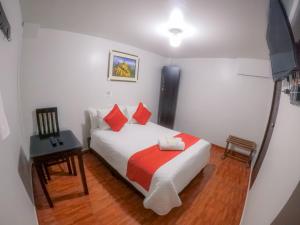 Łóżko lub łóżka w pokoju w obiekcie Machu Picchu Land