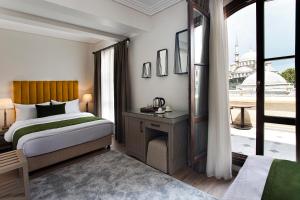 Un ou plusieurs lits dans un hébergement de l'établissement Mest Hotel Istanbul Sirkeci