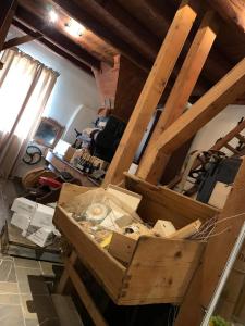 a room with a pile of boxes in a room at Mulino dell'Abbazia Country Resort in Corno di Rosazzo