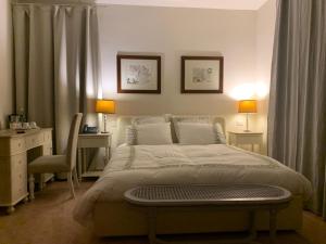 A bed or beds in a room at Mulino dell'Abbazia Country Resort