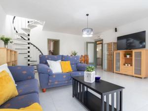 Televízia a/alebo spoločenská miestnosť v ubytovaní Casa de Vacaciones La Terraza