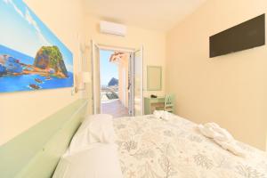 Postel nebo postele na pokoji v ubytování Albergo Atlantic