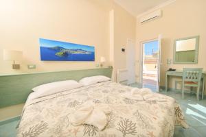 Postel nebo postele na pokoji v ubytování Albergo Atlantic