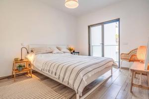 Ένα ή περισσότερα κρεβάτια σε δωμάτιο στο Happiness Apartment - 2bedroom apt in Aljezur