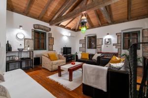 a living room with a couch and a table at Melina Heritage House in Cres