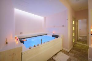 a pool in the middle of a room at Belgodere di Mezzavia Apartments in Ischia