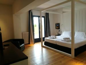Postel nebo postele na pokoji v ubytování Hotel Trias