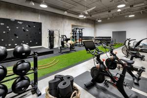 a gym with bikes and a climbing wall at 1 Hotel Toronto in Toronto