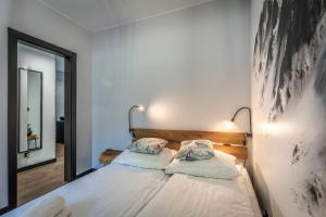 En eller flere senge i et værelse på ApartLoft Apartament Szczyrk SAUNA & FITNESS - Skrzyczne Residence