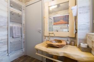 a bathroom with a wooden counter with a sink at Maison Milan in Sesto San Giovanni