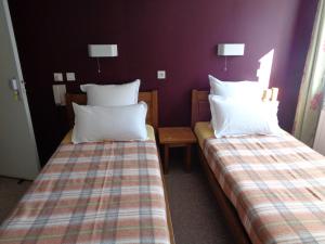 Postel nebo postele na pokoji v ubytování Auberge des genêts d'or