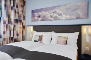 Letto o letti in una camera di Hotel Bristol Zurich