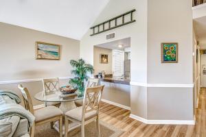 a dining room and kitchen with a table and chairs at Pelican Watch 1380 in Seabrook Island