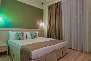 Postel nebo postele na pokoji v ubytování Savaneti Eco Hotel