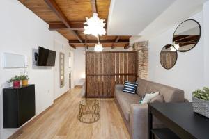 a living room with a couch and a table at Tina Home in Granada