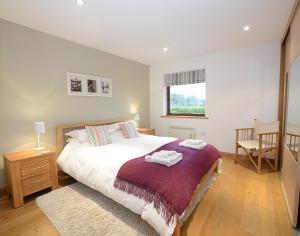 En eller flere senge i et værelse på Sandy Hills 8